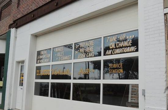 Diamond Wholesale Auto exterior. Sign for oil changes and air conditioning tune ups