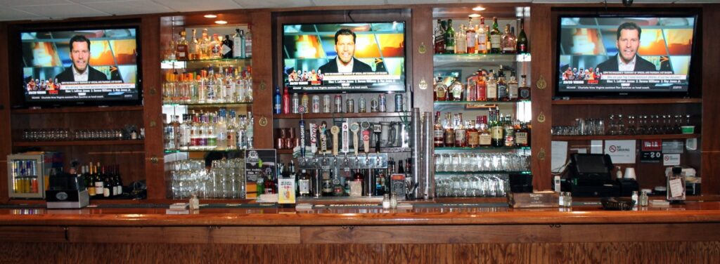 G Mig 5th street pub bar with bottles along the wall and TVs