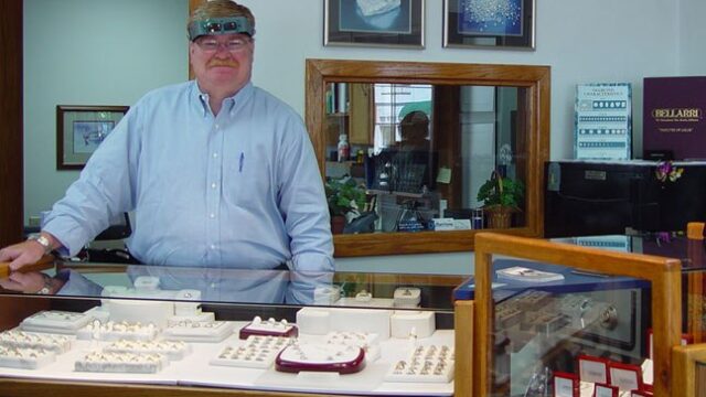 Morrissey Fine Jewelry with Morrissey at a counter with rings