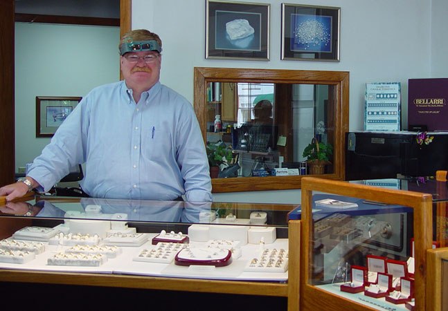 Morrissey Fine Jewelry with Morrissey at a counter with rings