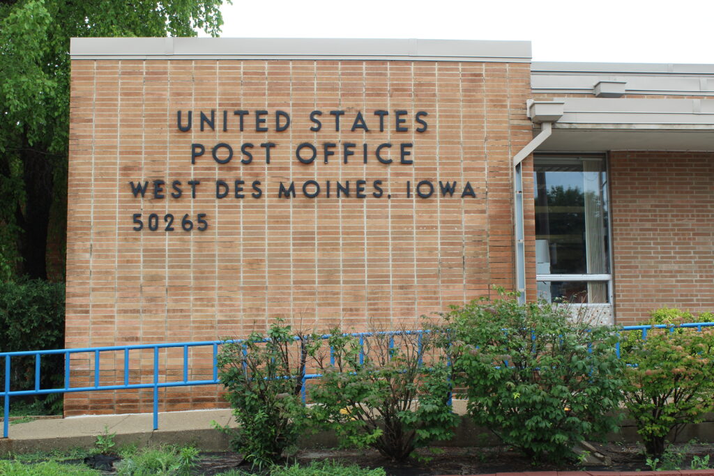 The front entrance to the brick United States Postal Office in West Des Moines, Iowa