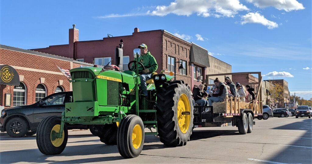 tractor hayride on 5th street in valley junction for pumpkin walk