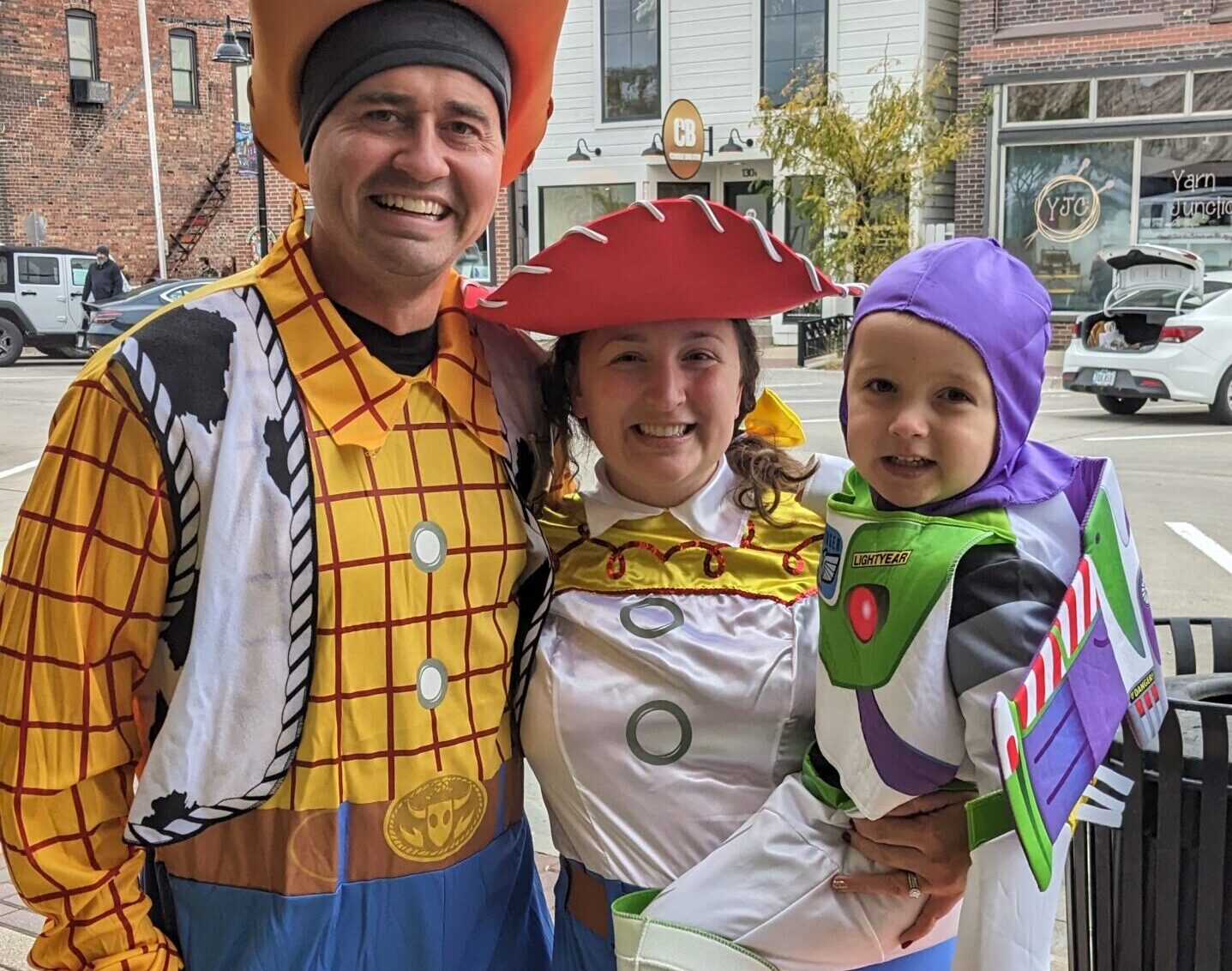 family dressed in toy story costumes at pumpkin walk