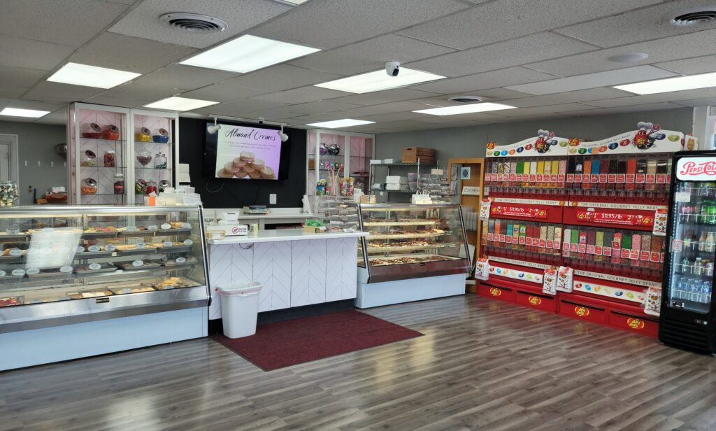 inside of Nan's Nummies with jelly belly wall, cases of cookies, chocolates, and fudge