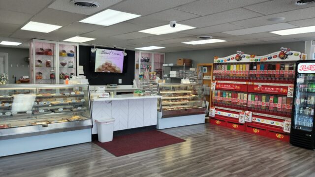 inside of Nan's Nummies with jelly belly wall, cases of cookies, chocolates, and fudge