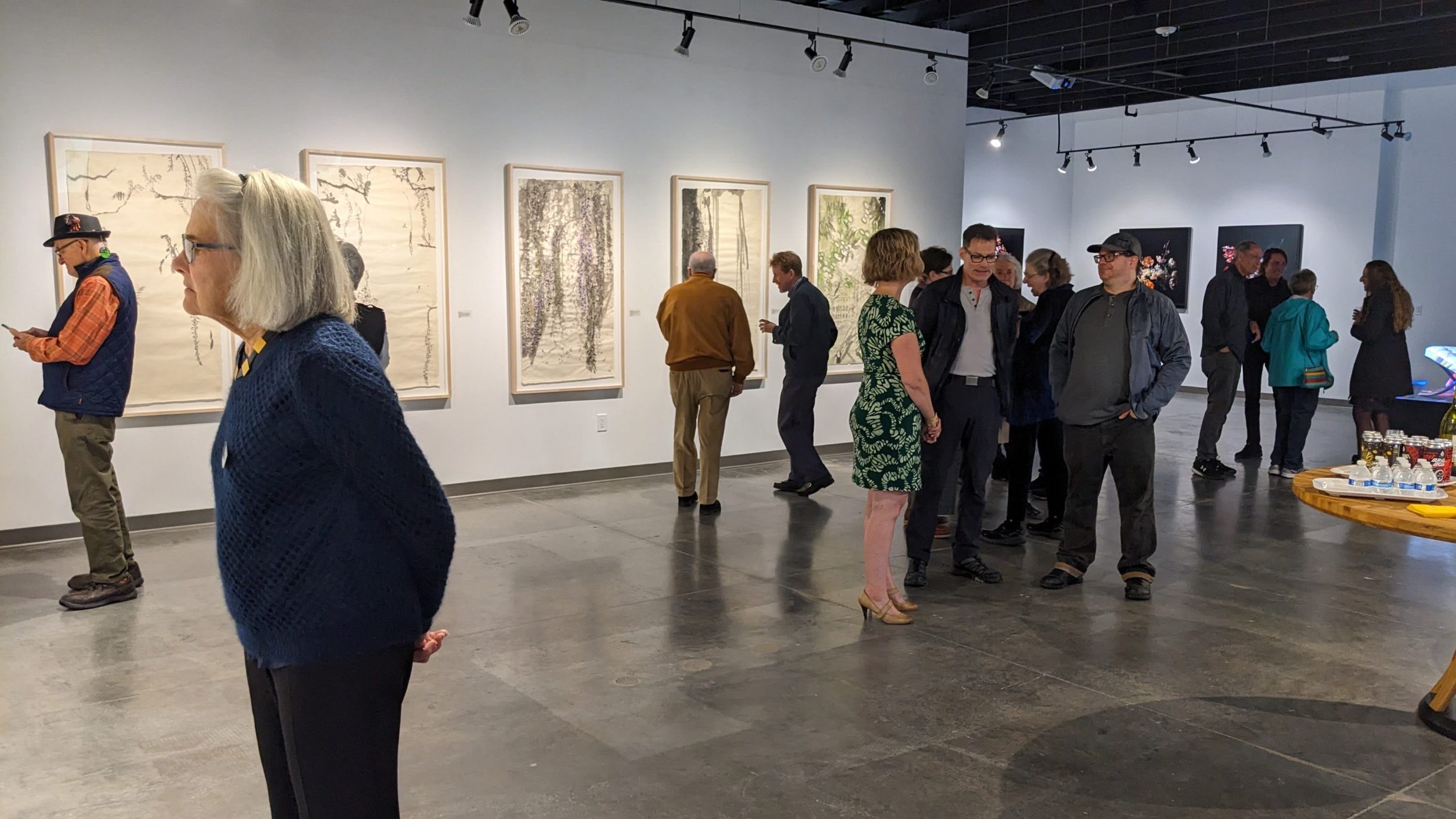 people looking at art in olson-larsen galleries during gallery night