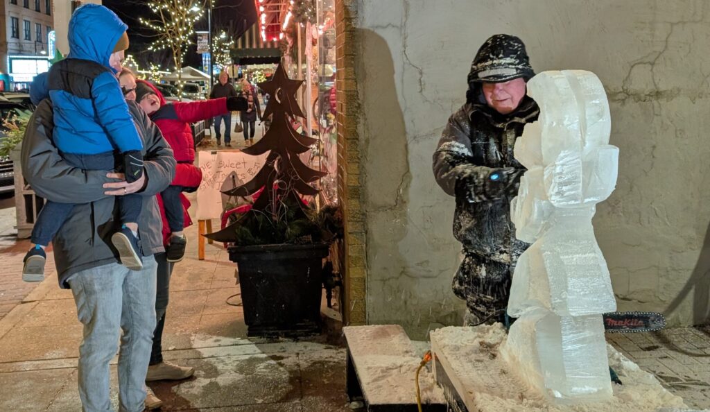 family watching bill gordish carve ice