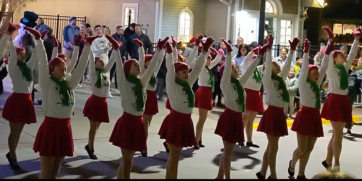 betty hill dancers in front of christmas tree at jingle in the junction